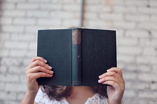 Image of a girl holding a book