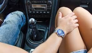 man's hand on a woman's thigh