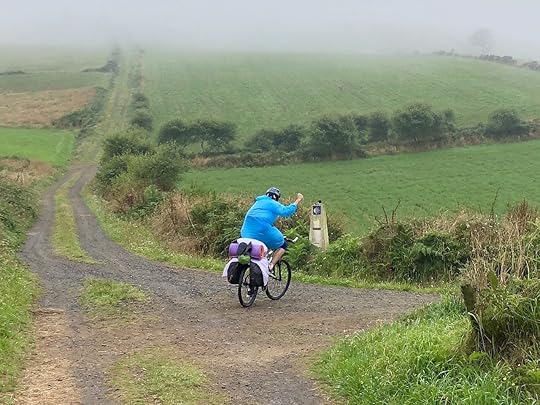Cyclist in the rain in Galicia