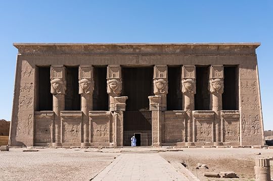 The Hathor temple with a two small figure of man in a white clothes. The Dendera complex near the Luxor in Egypt.