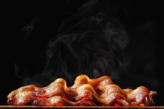 Pile of steaming hot freshly cooked bacon