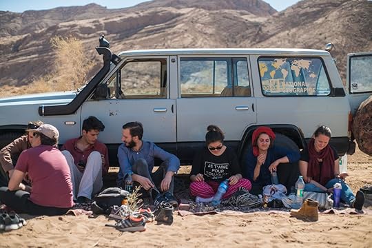 Sitting in front of a car in the Iranian desert