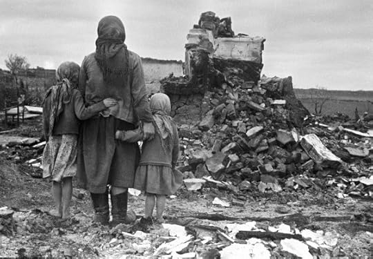 Russian mother and children looking at a destroyed home, Russia, 1 Sep 1943 (Russian International News Agency 982)