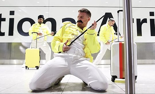Baggage handlers at Heathrow in London celebrating Freddie Mercury