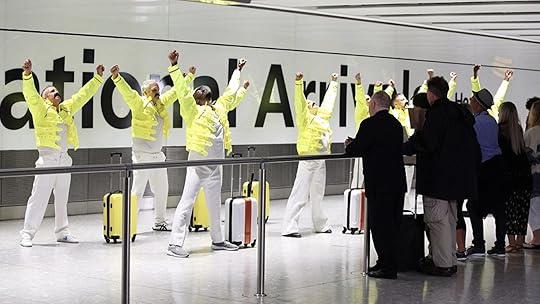 Baggage handlers at Heathrow in London celebrating Freddie Mercury