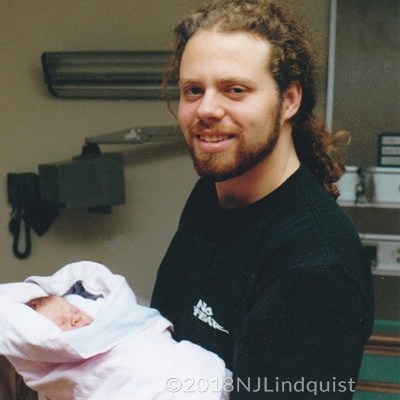 Our oldest son with his first child