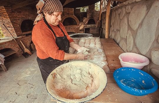 Woman baking homemade bread in Signagi, Georgia, Europe