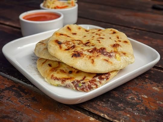 Plate of papusas with dipping sauce