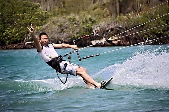 Kiteboarder riding a wave