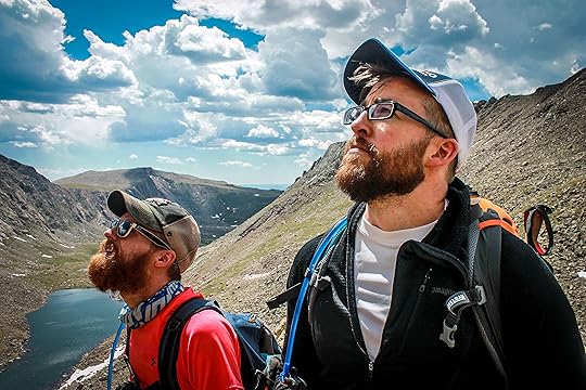 men climbing mountains together sharing bonding experience