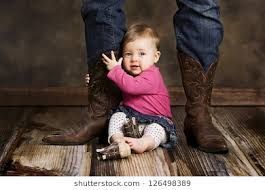 baby girl and cowboy boots
