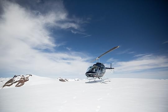 Nimmo Bay helicopter on snowy mountain face