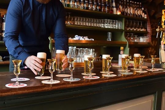 kopstoot, a Dutch beer and shot combo, line at a bar in Amsterdam