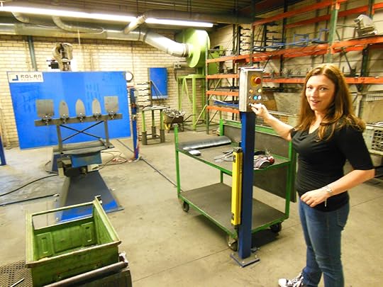 Pushing the button for the machine to turn on at DeWit tools.