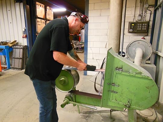 Garden tool being sharpened in the DeWit Tool factory.