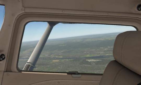  The island is on the right near the bottom of the head rest. The airport field is on the right 3/4 of the way down the wing strut. 