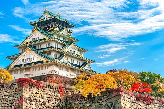 Osaka Castle in Osaka with autumn leaves Japan