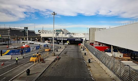 Commuters taking a taxi or Uber car at LaGuardia airport in New York City