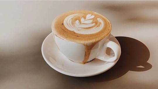 cup of coffee with design on top