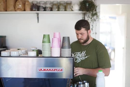Barista behind the counter at Flight Coffee in Wellington