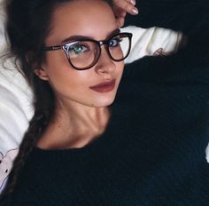pretty woman in glasses and bun
