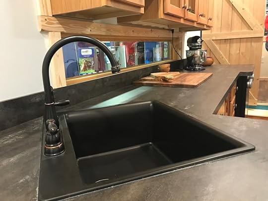 Full-sized sink and a generous counter, big enough to accommodate an induction-heat stovetop.