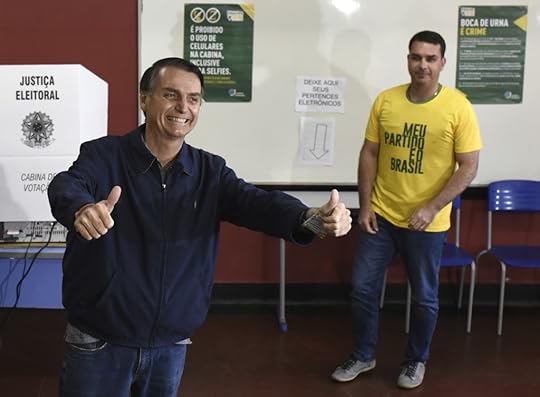 07 October 2018, Brazil, Rio de Janeiro: 07 October 2018, Brazil, Sao Paulo: Jair Bolsonaro (L), ultra-right candidate for the post of Brazilian president, laughs after casting his vote at a polling station in the city school Rosa da Fonseca, in Vila Militar, west of the city. In the background is his son Flavio Bolsonaro. In the midst of a severe crisis, the presidential election has begun in Brazil. Photo by: Fabio Teixeira/picture-alliance/dpa/AP Images