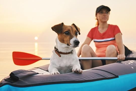 Woman kayaking with her jack russel terrier