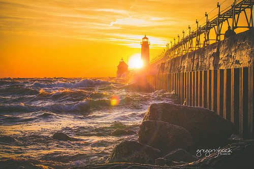 Sunset on Lake Michigan, Grand Haven lighthouse. Photographer Gregory Bozik