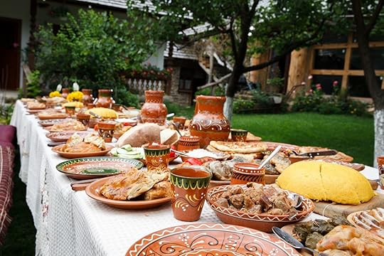 Long table piled with homemade Moldovan food