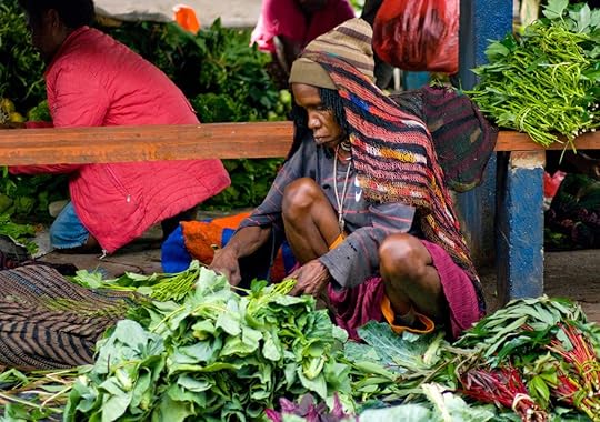 Vendor with vegetables at local market in New Guinea
