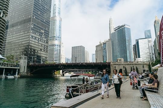 People walking by the Chicago river in Chicago
