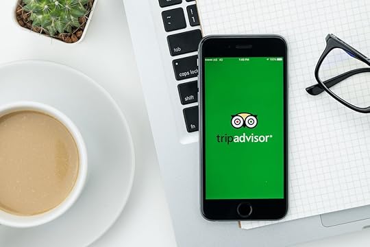 Apple iPhone with TripAdvisor application on the screen