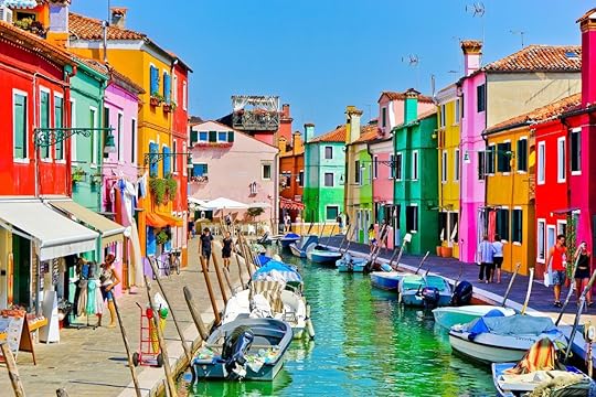 View of the colorful houses along the canal at the Islands of Burano in Venice