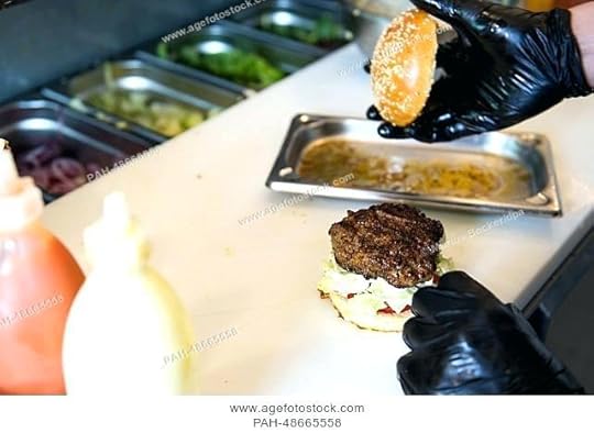 richie n rose burger an employee prepares a burger at the burger restaurant n rose in richie n rose burger oberkassel