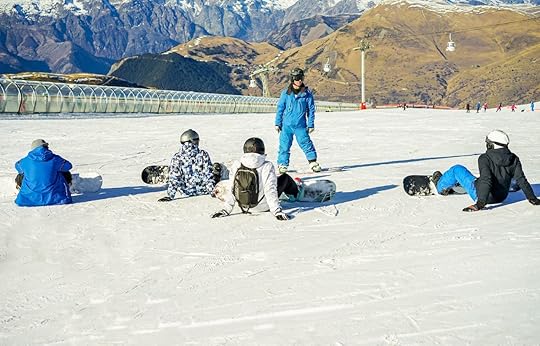 Snowboarder instructor teaching apprentice learners