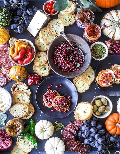This is the perfect autumn harvest bruschetta board to feed a crowd or serve at a party! The standout is pomegranate relish with a cinnamon shallot vinaigrette, lots of toasty bread, bruschettas, cheese and olives. Everything that's delish! I howsweeteats.com #bruschetta #board