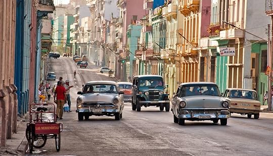 Old cars transiting in an avenue of Havana, Cuba