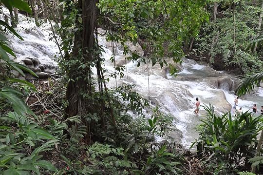 Tourists climbing the famous Dunns River Falls in Ocho Rios, Jamaica
