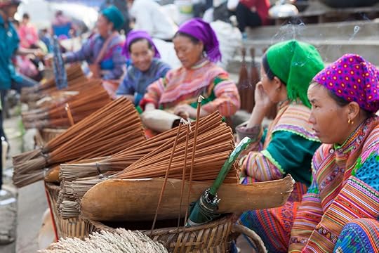 Vietnamese Hmong minority women selling incense at Bac Ha traditional weekly flea market.
