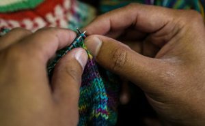 Pedro Gonzalez of Dallas knits a sock at Holley's Yarn Shoppe in Dallas. He can knit a sock while he watches a movie. (Carly Geraci)