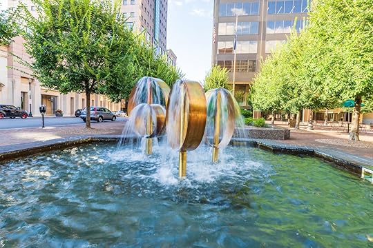 A bronze ring fountain in the middle of downtown Louisville