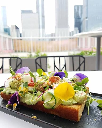 Sandwich on a restaurant table with a view of Chicago
