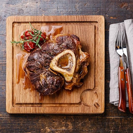 osso bucco on a wooden cutting board