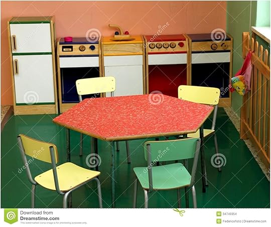 Toy Kitchen and Chairs to Play In A Nursery Stock Photo Table top toy Kitchen