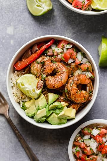 These Shrimp Fajita Bowls are a tasty and easy dinner that your whole family will love! Served over a bed of cilantro-lime rice with peppers and onions, avocado and salsa.