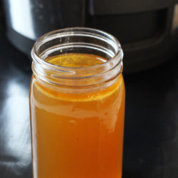 jar of chicken stock with slow cooker