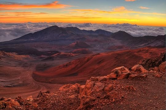 Volcanic crater landscape with beautiful orange clouds at sunrise at Haleakala National Park in Maui, Hawaii