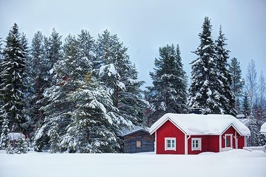 Finnish winter landscape with red wooden finnish house covered with snow