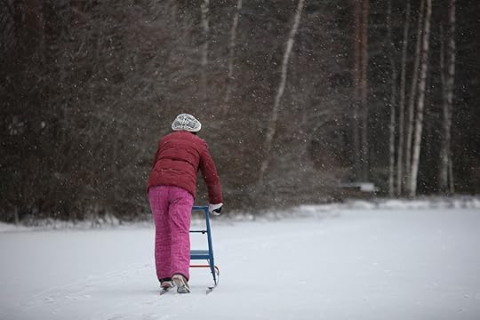 old woman walking the snow
